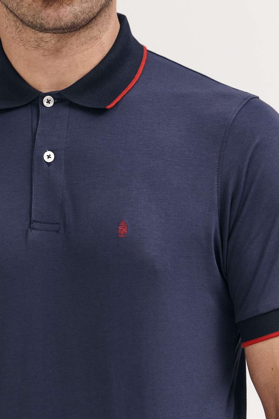 Polo mangas cortas cuello puños vivos