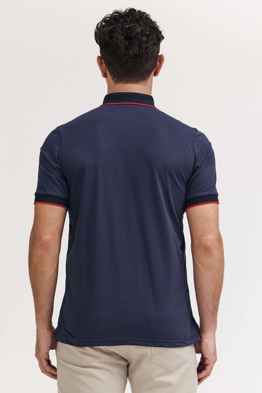 Polo mangas cortas cuello puños vivos